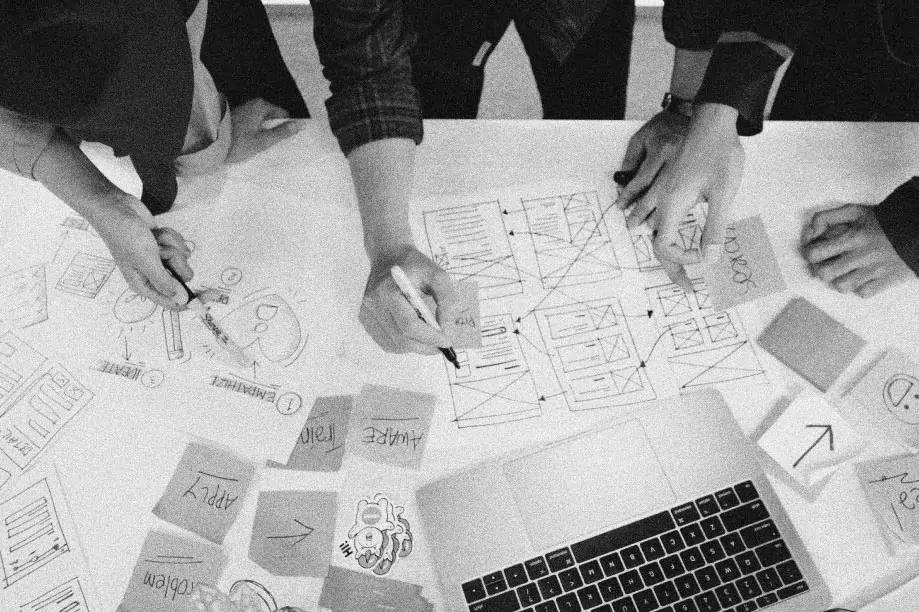 A group of people collaborating on a design concept and wireframing.