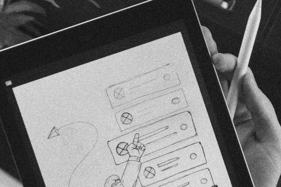 Someone sketching out an idea for a menu interface on a drawing tablet.